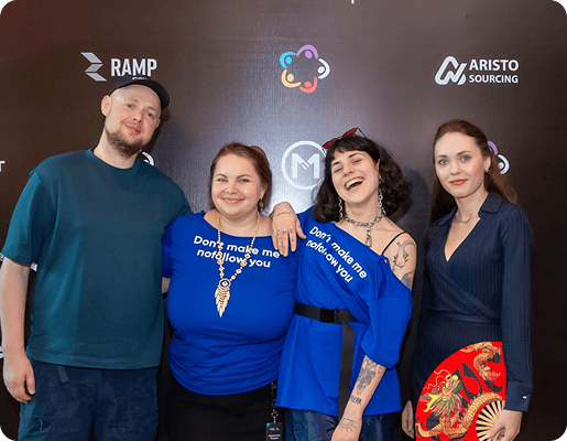 Групове фото чотирьох учасників команди Collaborator, які позують разом на саміті SEO Mastery 2025